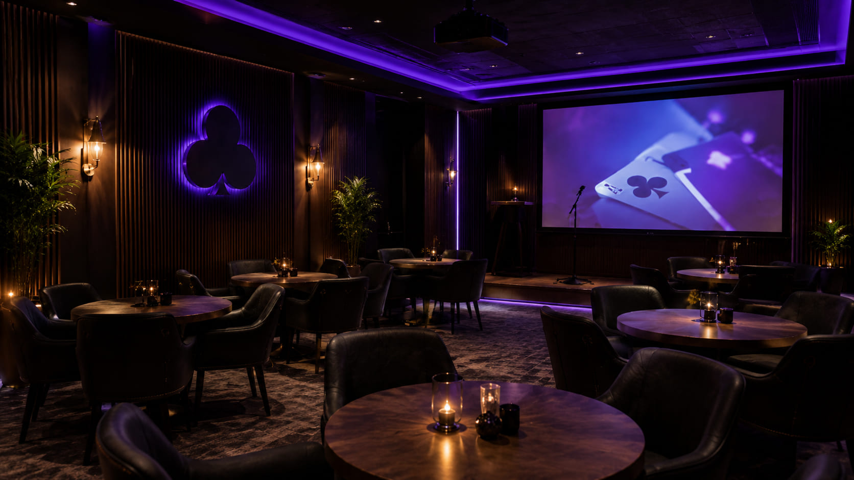Ekrany transmisyjne w strefie lounge Guildhouse Club — wieczór z pokerem